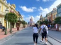People walking up to Cinderella`s Castle in the Magic Kingdom at  Walt Disney World Resorts in Orlando, FL Royalty Free Stock Photo