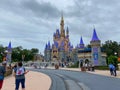 People walking up to Cinderella`s Castle in the Magic Kingdom at  Walt Disney World Resorts in Orlando, FL Royalty Free Stock Photo