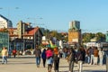 People walking in the urban area with a grand clock tower in the background in Puerto Montt, Chile Royalty Free Stock Photo