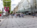 People walking and visiting the famous street in Paris, the Champs dÃÂ´elysees in the heart of Paris