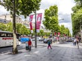 People walking and visiting the famous street in Paris, the Champs dÃÂ´elysees in the heart of Paris