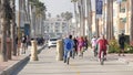 People walking, waterfront promenade beachfront boardwalk. Ocean beach near Los Angeles, California USA Royalty Free Stock Photo