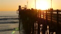 People walking, wooden pier in California USA. Oceanside waterfront vacations tourist resort. Royalty Free Stock Photo