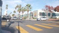 People walking on zebra, pedestrians on crossroad, road intersection California.