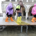 people walks on footbridge in Venice in Italy during tide and th Royalty Free Stock Photo