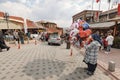 A balloon seller woman on the street. People wandering and shopping at the bazaar in Ankara Kaleici