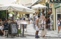 People wandering the streets, shopping and dining in Plaka district