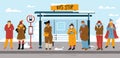 People in warm clothes on bus stop in winter Royalty Free Stock Photo