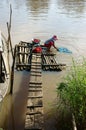 People washing clothes on river Royalty Free Stock Photo