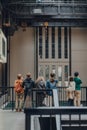 People watch aerobes of Anicka Yi`s installation In Love With The World in Turbine Hall of Tate Modern, London, UK Royalty Free Stock Photo