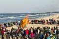 People watch the easter fire at the beach