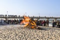 People watch the easter fire at the beach