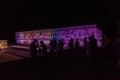 People watch a light show at Nun`s Quadrangle Cuadrangulo de las Monjas building complex at the ruins of the ancient Royalty Free Stock Photo