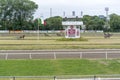 People watch trotting derby, Sunshine on the trotting track. Horses, Jocky, Sulky Royalty Free Stock Photo