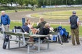 People watch trotting derby, Sunshine on the trotting track. Horses, Jocky, Sulky Royalty Free Stock Photo