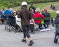 People watch trotting derby, Sunshine on the trotting track. Horses, Jocky, Sulky Royalty Free Stock Photo