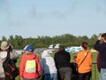 People are watching an airplane show on AirShow