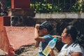 People watching the annular solar eclipse in Mexico with special observation glasses