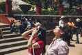 People watching the annular solar eclipse in Mexico with special observation glasses