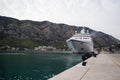 People watching the arrival of a cruise ship at the port of Kotor