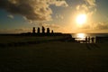 People watching beautiful sunset over the Pacific ocean at Ahu Tahai with Moai statues, Easter Island of Chile Royalty Free Stock Photo