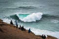 People Watching the Big Waves in Nazare - Nazare, Portugal