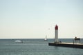 People watching boats at lighthouse Royalty Free Stock Photo