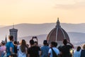 People watching Florence panorama - Cathdral. Sunset from Piazzale Michelangelo. Tuscany, Italy