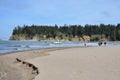 People Watching Paddle Boarders In Sunset Bay State Park, Oregon