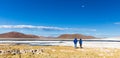 People watching pink flamingo birds salt lake, Bolivia. Royalty Free Stock Photo