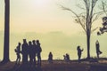 People watching Sunrise in the morning. Tourists travel relax in the holiday. photograph sunrise in the morning among people.