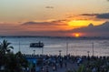 People watching sunset at Manila Bay in the Philippines