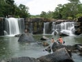 People at a waterfall in Thailand