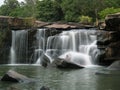 People at a waterfall in Thailand