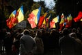 People wave the Romanian flag during a rally