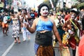 People wear unique and colorful costumes on a carnival on Malioboro street