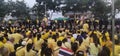 People wear yellow shirts shirts to greet their King.