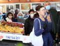 People wearing face masks and gloves for prevention of coronavirus COVID-19 on a marketplace in Sofia, Bulgaria on 04/14/2020