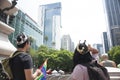 People wearing king and queen crowns plus rainbow flag for LGBTTI pride in Mexico city