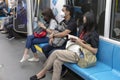 Jakarta, Indonesia - June 30 2022: People wearing mask and doing their own activities inside the Jakarta MRT Train.