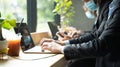 People wearing mask working at coffee shop