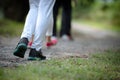 People wearing sport shoes walking and running in the park Royalty Free Stock Photo