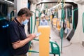 People wearing surgical mask in the train during the Covid-19 pandemic Royalty Free Stock Photo