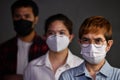 People wearing surgical masks looking worried concerned with pandemic outbreak Coronavirus covid-19situation