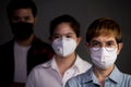 People wearing surgical masks looking worried concerned with pandemic outbreak situation