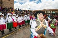 People wearing traditional clothes and masks dancing the Huaylia in the Christmas day in front of the Cuzco Cathedral in Cuzco, Pe