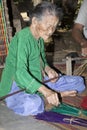 People weaving sedge grass mats.