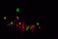 People who let Colorful, Glowing Balloons Fly in the Dark Night Sky Royalty Free Stock Photo