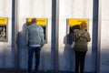 People withdraws money from ATM machine, Netherlands