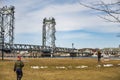 People wlak with the Memorial Bridge on the background during the winter. Portsmouth NH